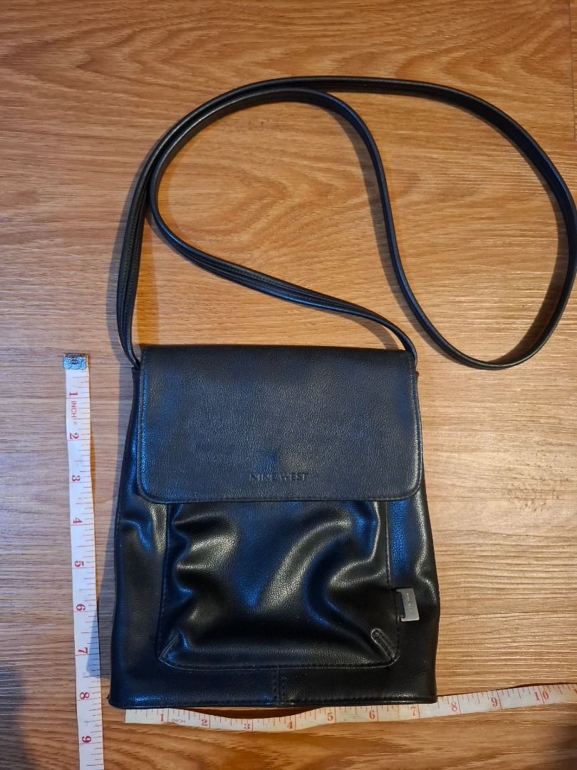 Authentic Nine West Black Leather Crossbody Bag (Category: Cross-body Bags) located in Bacolod City. Submitted by gluisa97 (Listing ID 1449816268, Image 2). Description: - Material: Leather, still soft & well cared for with leather cleaner - Closure: Flap with magnetic snap - Interior: 1 zippered pocket, 1 slip pocket - Perfect staple bag for casual & everyday wear! - Flaw: Back zipper tab has fallen off. Replaced with keyring, still works well. 