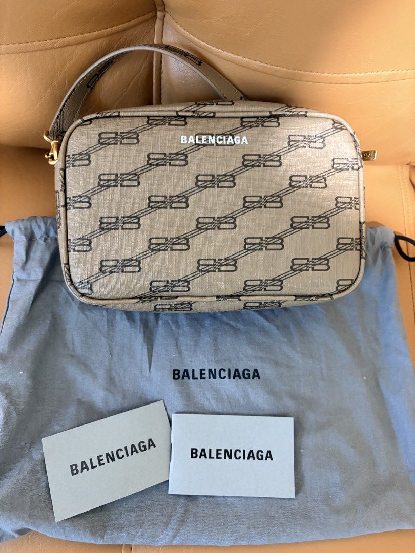 Balenciaga Monogram Camera Bag (Category: Luxury Bags & Wallets) located in Pasig City. Submitted by joypee737 (Listing ID 1449775815, Image 1). Description: - Authentic Balenciaga Camera Bag - All-over monogram print - Includes dust bag and authenticity cards - Gold hardware details - Zipper closure - Ideal for everyday use.