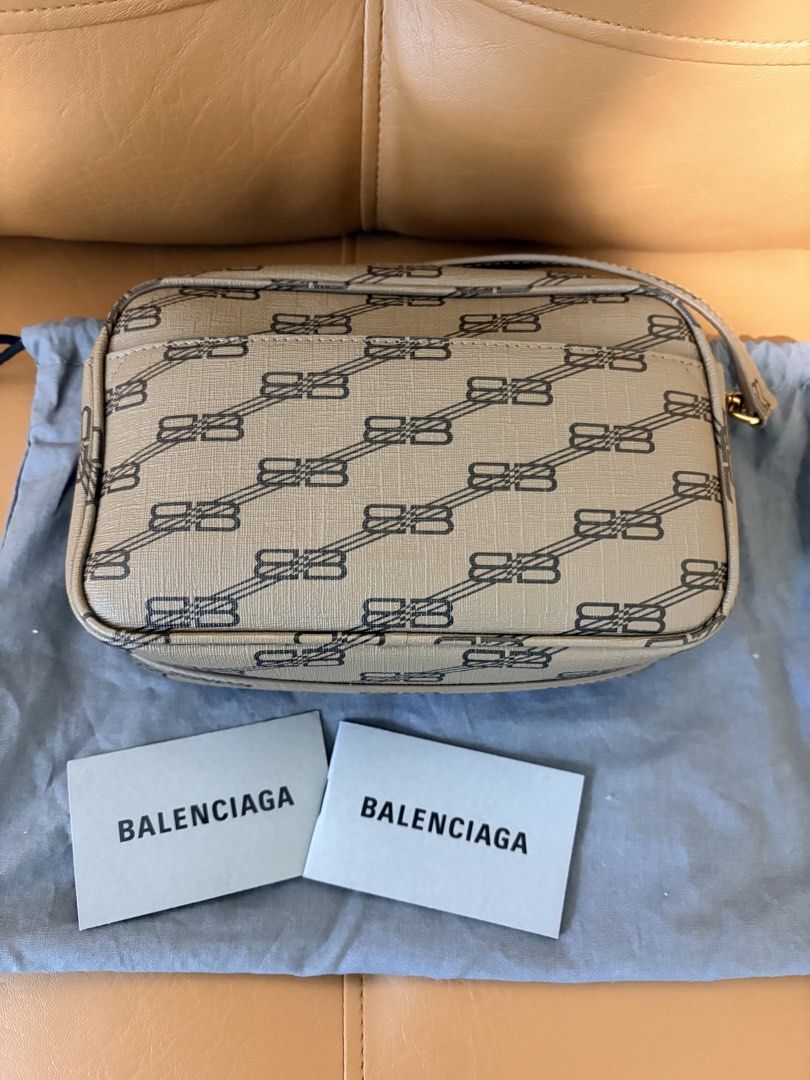 Balenciaga Monogram Camera Bag (Category: Luxury Bags & Wallets) located in Pasig City. Submitted by joypee737 (Listing ID 1449775815, Image 2). Description: - Authentic Balenciaga Camera Bag - All-over monogram print - Includes dust bag and authenticity cards - Gold hardware details - Zipper closure - Ideal for everyday use.