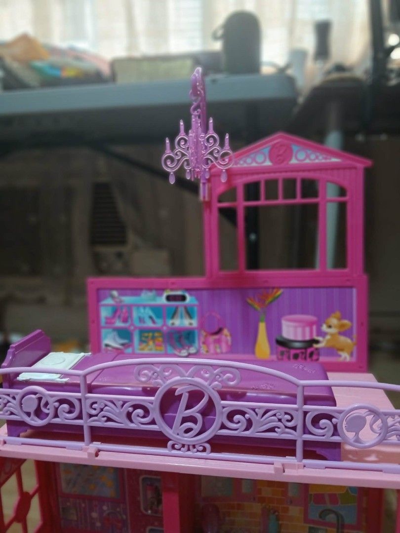 Barbie Glam Vacation house (Category: Kids Toys) located in Las Pinas. Submitted by newmoon-2990 (Listing ID 1449846108, Image 2). Description: - Barbie Glam Vacation house with box - Includes most furniture and accessories (missing 1 accessory) - includes Barbie car - Perfect for imaginative play.