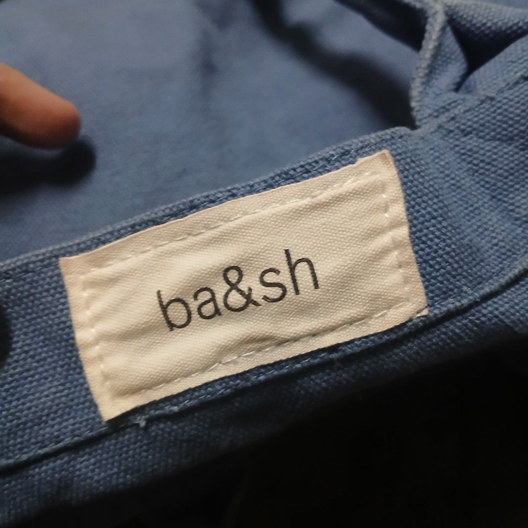 Ba&sh Paris Blue Canvas Tote Bag (Category: Tote Bags) located in Cagayan de Oro. Submitted by susanthrifts (Listing ID 1449763097, Image 2). Description: - Ba&sh Paris blue canvas tote bag - Features brand name printed on the front - White lining inside - Dimensions: Approx. 15" wide x 11" tall - Handle length: Approx. 7 inches - Ideal for everyday use - GWP - Makapal po sya.