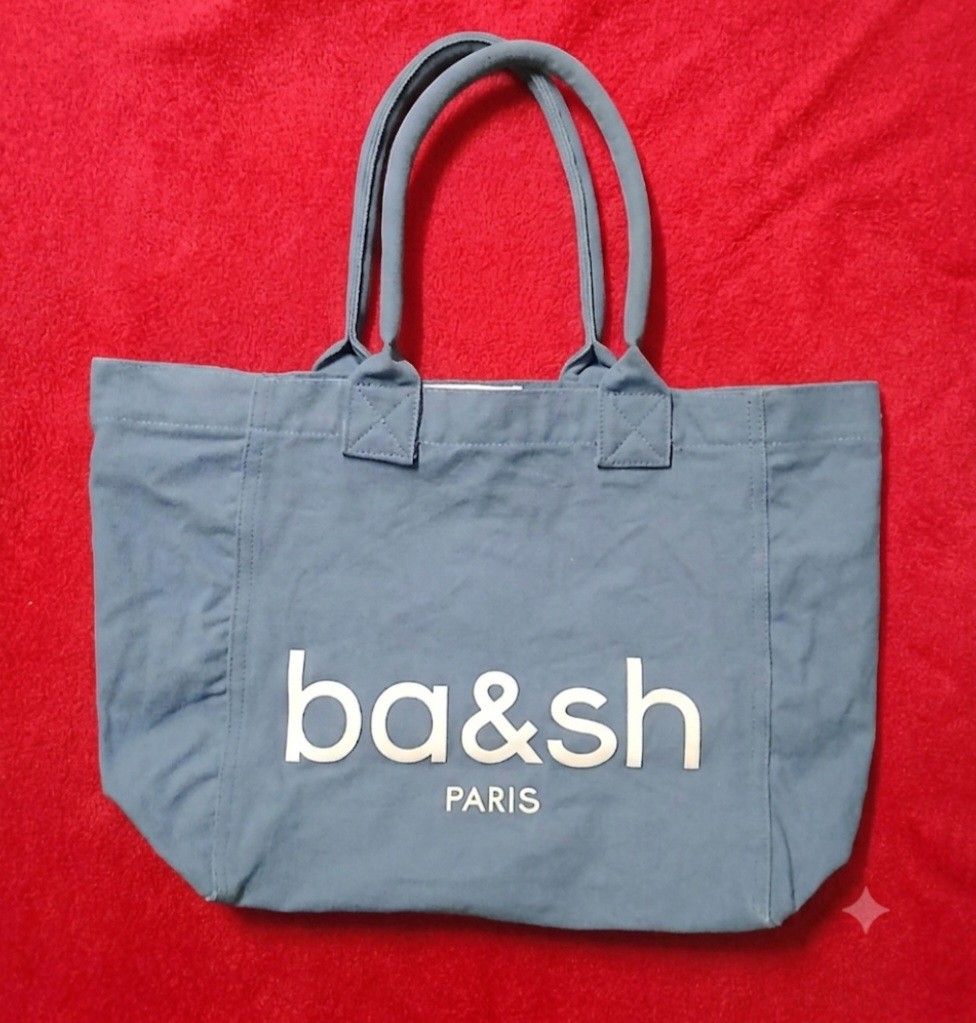 Ba&sh Paris Blue Canvas Tote Bag (Category: Tote Bags) located in Cagayan de Oro. Submitted by susanthrifts (Listing ID 1449763097, Image 1). Description: - Ba&sh Paris blue canvas tote bag - Features brand name printed on the front - White lining inside - Dimensions: Approx. 15" wide x 11" tall - Handle length: Approx. 7 inches - Ideal for everyday use - GWP - Makapal po sya.