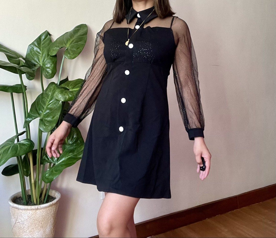 Black Mesh Sparkle Sleeve Collared Dress,s to m (Category: Dresses) located in Mandaluyong City. Submitted by roxieeeeeee (Listing ID 1449809721, Image 3). Description: - Black mini dress - Sheer sparkly sleeves - Collared neckline - Large white button details down the front - Subtle sparkle overlay on bodice - Ideal for night outs or parties - Fits true to size ✅ Like new condition ✅ Ships 1 day after payment ✅ Please allow 1 day for preparation