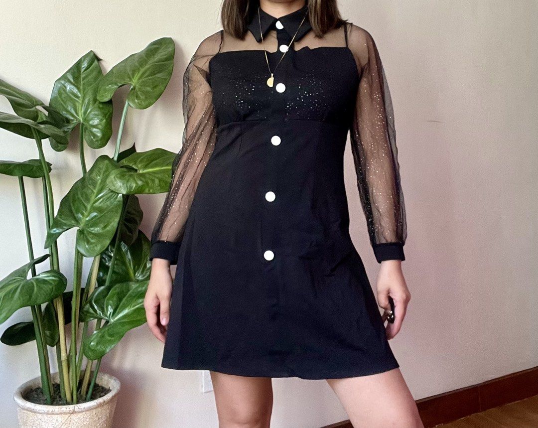 Black Mesh Sparkle Sleeve Collared Dress,s to m (Category: Dresses) located in Mandaluyong City. Submitted by roxieeeeeee (Listing ID 1449809721, Image 1). Description: - Black mini dress - Sheer sparkly sleeves - Collared neckline - Large white button details down the front - Subtle sparkle overlay on bodice - Ideal for night outs or parties - Fits true to size ✅ Like new condition ✅ Ships 1 day after payment ✅ Please allow 1 day for preparation