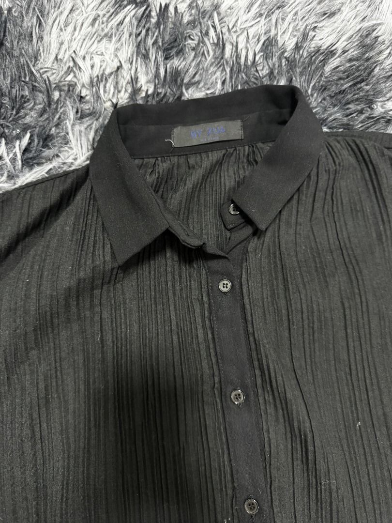 Black Pleated Long Sleeve Button-Up Shirt (Category: Tshirts & Polo Shirts ) located in Puerto Princesa. Submitted by 22B_Garments (Listing ID 1449807489, Image 2). Description: - Pleated texture all over - Ruffled, pleated cuffs WIDTH: 27.5 LENGTH: 24.