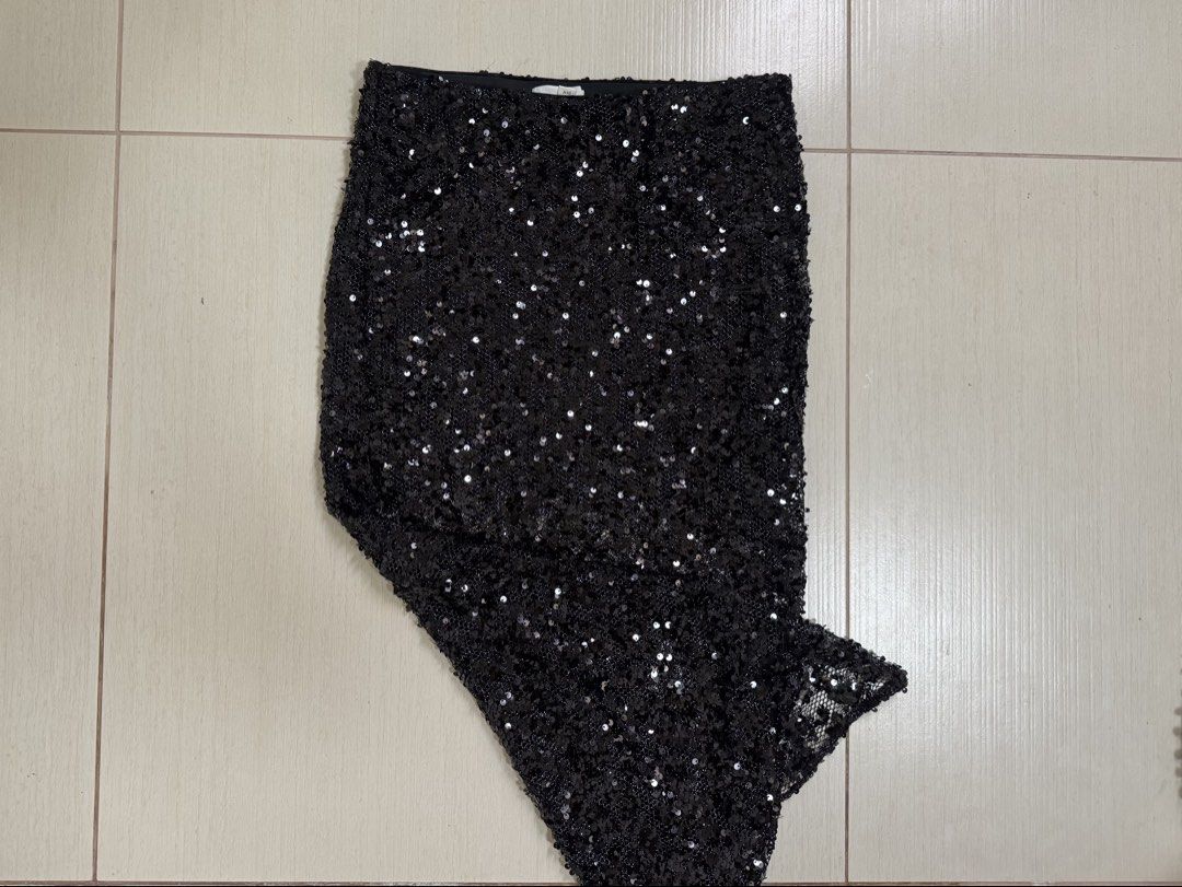 Black Sequin Maxi Skirt with Mesh Overlay (Category: Skirts) located in San Fernando. Submitted by khdzn (Listing ID 1449889185, Image 2). Description: • super chic yet classy sparkly maxi skirt. • has underskirt beneath the top portion but goes sheer at the bottom. • can go up to medium because it has elastic waistband. • sequins aren’t itchy at all ! this was only worn once..