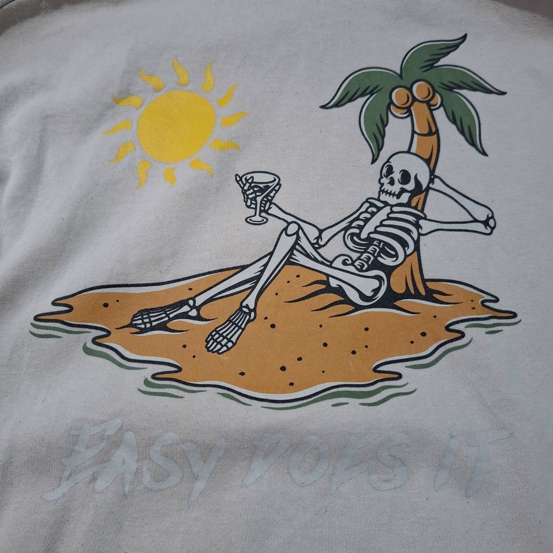 Bowery Supply Skeleton Beach Graphic Hoodie (Category: Hoodies) located in Legazpi City. Submitted by thrift_ni_mark (Listing ID 1449879668, Image 3). Description: - Cool graphic hoodie from Bowery Supply - Features a unique skeleton chilling on a beach graphic - 'Easy Does It' text on the front - Ideal for casual and laid-back outfits - Made in Honduras.