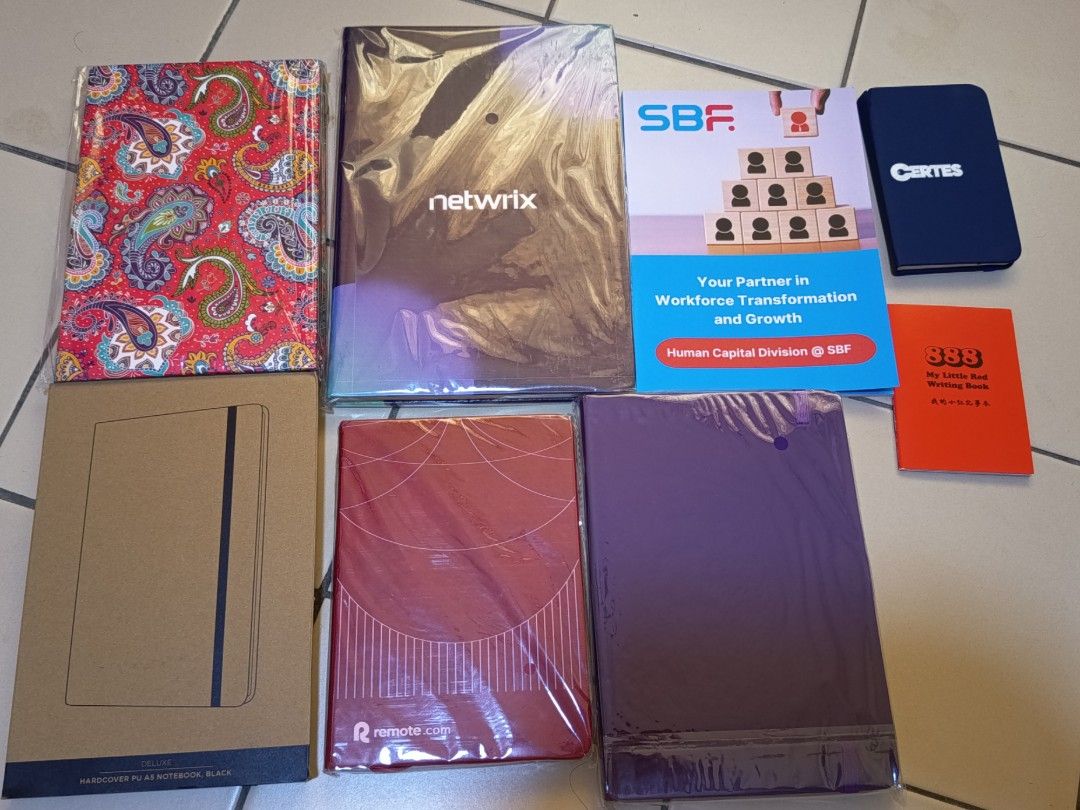Bundle Assorted Notebooks (Category: Stationery & School Supplies) located in Singapore. Submitted by grownupbby (Listing ID 1449749820, Image 1). Description: - Red paisley notebook - Netwrix branded notebook - SBF planner - Certis notebook - Brown boxed notebook - Red patterned notebook - Purple notebook All in good condition, some still in original packaging..