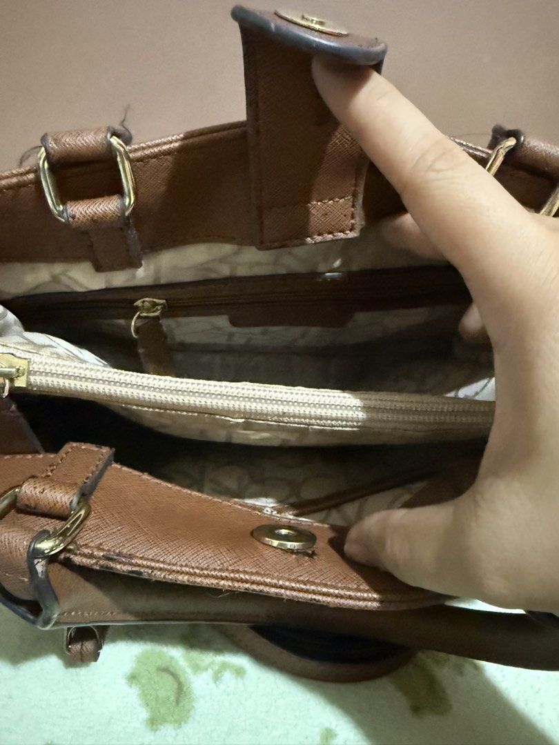 Calvin Klein Monogram Tote Bag with Strap (Category: Luxury Bags & Wallets) located in Quezon City. Submitted by skyeseller (Listing ID 1449861329, Image 3). Description: - Authentic brown Calvin Klein monogram tote bag - Features a convenient front zip pocket - Interior includes a secure zip compartment - Comes with a detachable shoulder strap for versatile carrying - Major wear visible on top edges and handles.