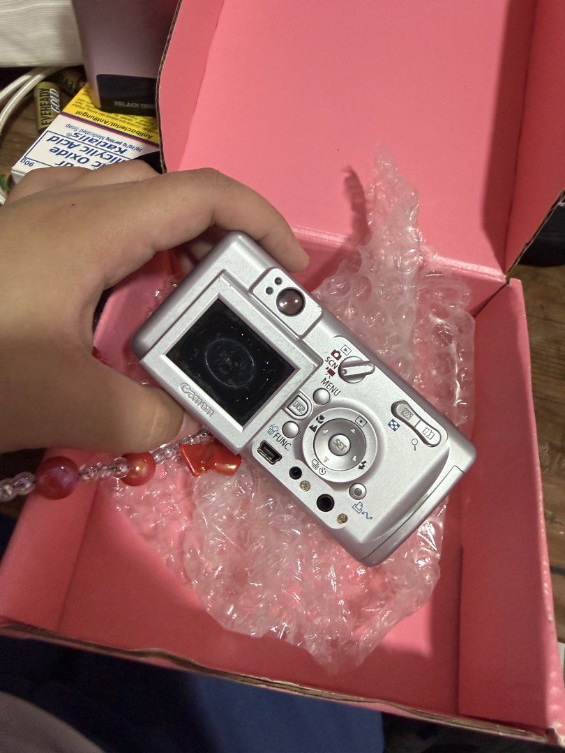 Canon Powershot a400 (Category: Cameras) located in Manila. Submitted by carmexxgam34868 (Listing ID 1449902398, Image 2). Description: NEGOTIABLE - Silver Canon digital camera - Includes beaded strap - Features cute stickers on the front - All buttons are present and functional - Ready for your next adventure! Issue: LCD WRAP 8/10 body condition .