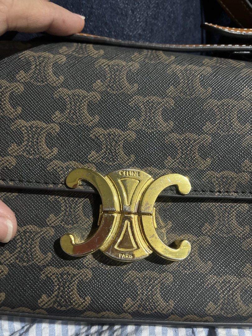 Celine Triomphe Canvas Bag (Category: Luxury Bags & Wallets) located in Meycauayan. Submitted by dresswiththefurr (Listing ID 1449936325, Image 2). Description: - Classic Celine Triomphe bag - Brown and tan monogram canvas - Gold hardware with iconic Triomphe clasp - Adjustable leather strap - Spacious tan leather interior - Versatile for daily use or special occasions.