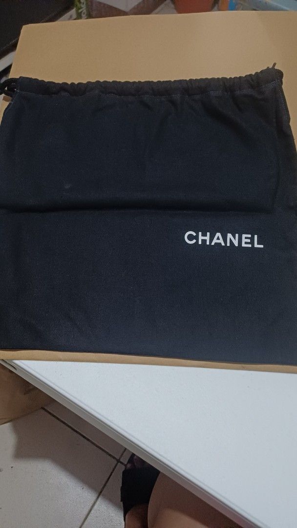 Chanel Dust Bag (Category: Luxury Bags & Wallets) located in Rizal. Submitted by jekomy (Listing ID 1449932346, Image 1). Description: - Genuine Chanel dust bag - Dimensions: 12 inches (height) x 13 inches (width) - Features a secure drawstring closure - Ideal for storing and protecting handbags or shoes - Guards against dust and scratches - Ready for its new home.