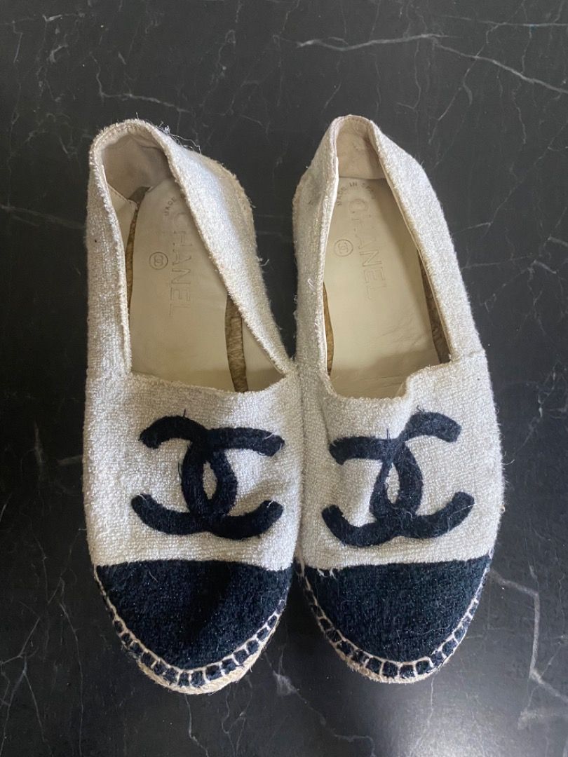 Chanel Espadrilles Flats Shoes (Category: Flats & Sandals) located in Manila. Submitted by haveago0dthrift (Listing ID 1449821520, Image 2). Description: - Chanel Espadrilles - Size: 39 - Design: Classic black & white tweed with iconic CC logo - Origin: Made in Spain - Condition: Good overall, with some visible wear on the soles - Features: Comfortable and stylish for everyday wear.