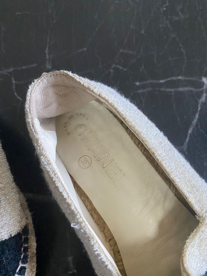 Chanel Espadrilles Flats Shoes (Category: Flats & Sandals) located in Manila. Submitted by haveago0dthrift (Listing ID 1449821520, Image 3). Description: - Chanel Espadrilles - Size: 39 - Design: Classic black & white tweed with iconic CC logo - Origin: Made in Spain - Condition: Good overall, with some visible wear on the soles - Features: Comfortable and stylish for everyday wear.