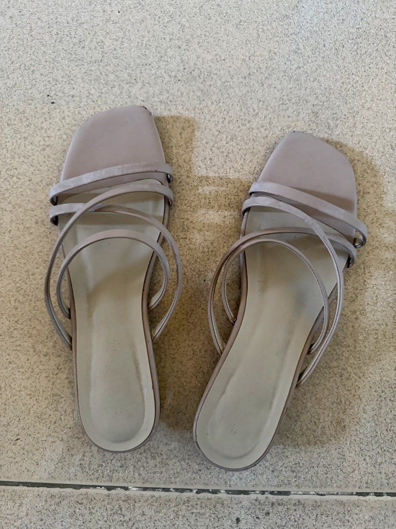 Charles and Keith Sandals Strappy Design 38 (Category: Flats & Sandals) located in Quezon City. Submitted by eleventwelveph (Listing ID 1449769801, Image 1). Description: - Light beige flat sandals - Minimalist strappy design - Square toe shape - Comfortable for everyday wear - Easy slip-on style.