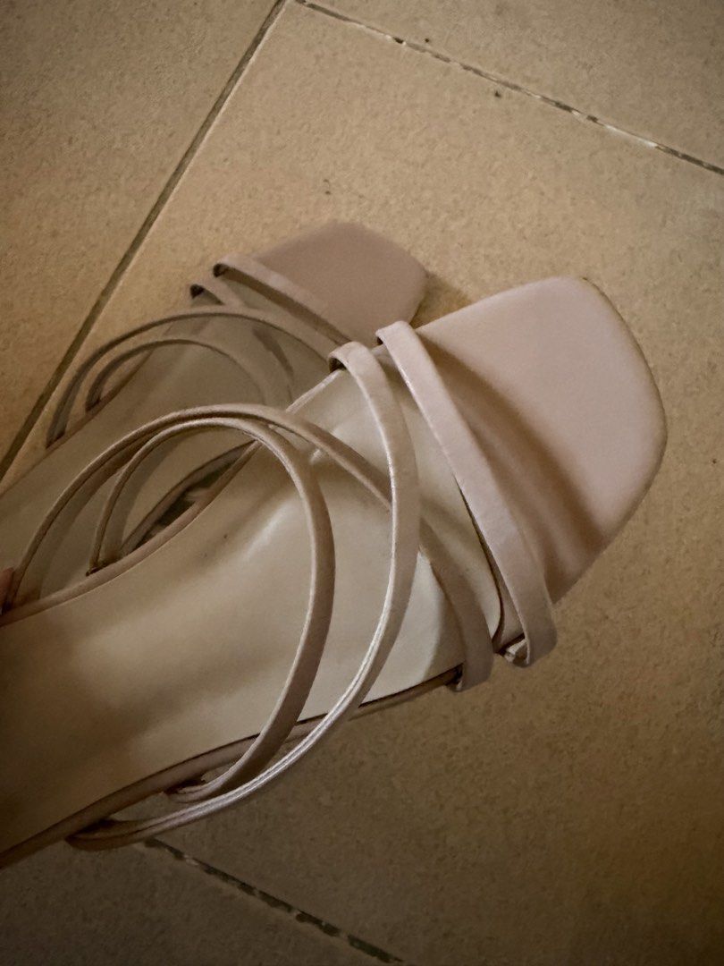 Charles and Keith Sandals Strappy Design 38 (Category: Flats & Sandals) located in Quezon City. Submitted by eleventwelveph (Listing ID 1449769801, Image 3). Description: - Light beige flat sandals - Minimalist strappy design - Square toe shape - Comfortable for everyday wear - Easy slip-on style.