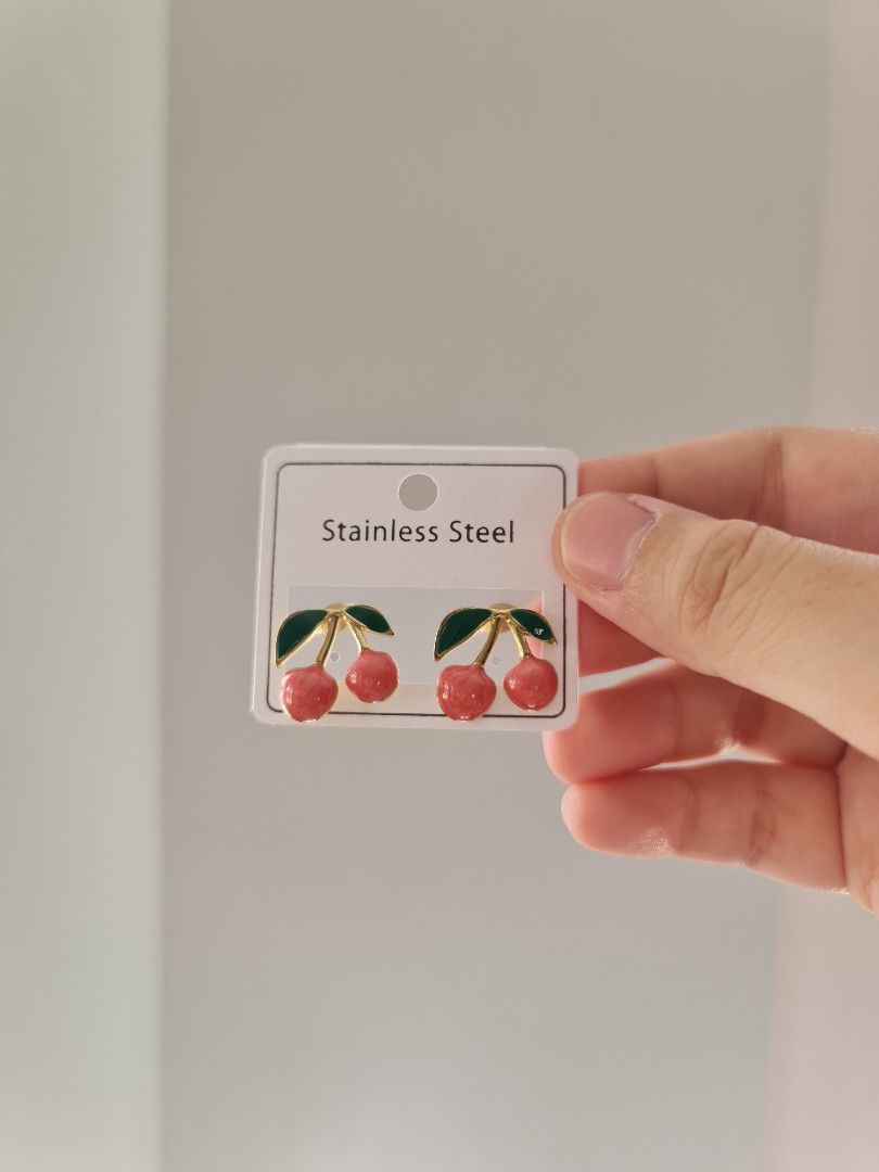 Cherry Stainless Steel Fruit Gold Stud Earrings (Category: Earrings) located in Dasmarinas. Submitted by danabrie22 (Listing ID 1449771088, Image 1). Description: this is brand new, never been worn earrings, made of stainless steel material, ideal for styling your outfit,be given as a gift, photoshoots, beach trip, themed parties, etc..