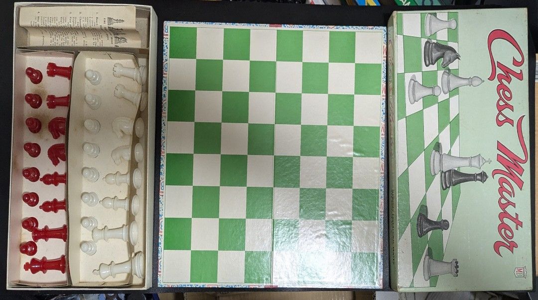Chess Master Chess Set with Board and Pieces (Category: Board Games & Puzzles) located in Mandaluyong City. Submitted by w334800 (Listing ID 1449940078, Image 1). Description: - Complete Chess Master set - Includes game board and all red & white chess pieces - Pieces stored in original box inserts - Box features chess graphics and 'Chess Master' title.