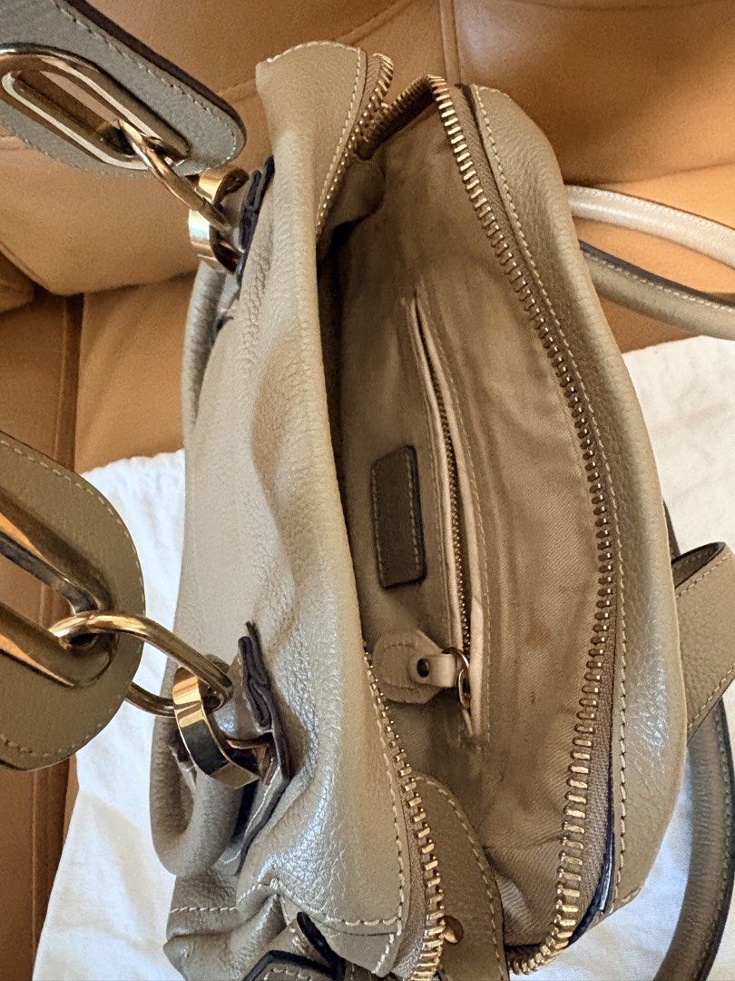 Chloe Marcie Small Bag Taupe Leather (Category: Luxury Bags & Wallets) located in Pasig City. Submitted by joypee737 (Listing ID 1449777898, Image 3). Description: - Authentic Chloe Marcie Bag - Color: Taupe - Material: Soft, pebbled leather - Signature curved seam - Gold hardware - Top handle - Detachable shoulder strap - Interior zip pocket - Dust bag included, with cards - Great everyday size.