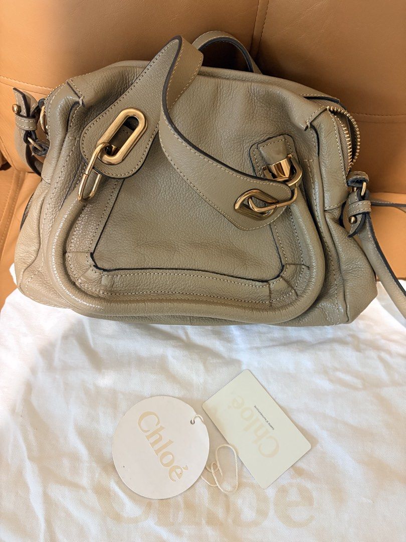 Chloe Marcie Small Bag Taupe Leather (Category: Luxury Bags & Wallets) located in Pasig City. Submitted by joypee737 (Listing ID 1449777898, Image 2). Description: - Authentic Chloe Marcie Bag - Color: Taupe - Material: Soft, pebbled leather - Signature curved seam - Gold hardware - Top handle - Detachable shoulder strap - Interior zip pocket - Dust bag included, with cards - Great everyday size.