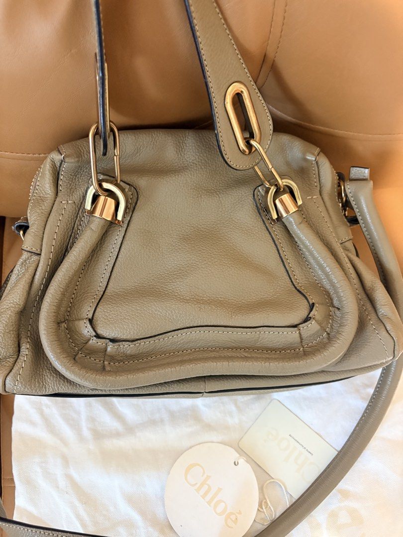Chloe Marcie Small Bag Taupe Leather (Category: Luxury Bags & Wallets) located in Pasig City. Submitted by joypee737 (Listing ID 1449777898, Image 1). Description: - Authentic Chloe Marcie Bag - Color: Taupe - Material: Soft, pebbled leather - Signature curved seam - Gold hardware - Top handle - Detachable shoulder strap - Interior zip pocket - Dust bag included, with cards - Great everyday size.