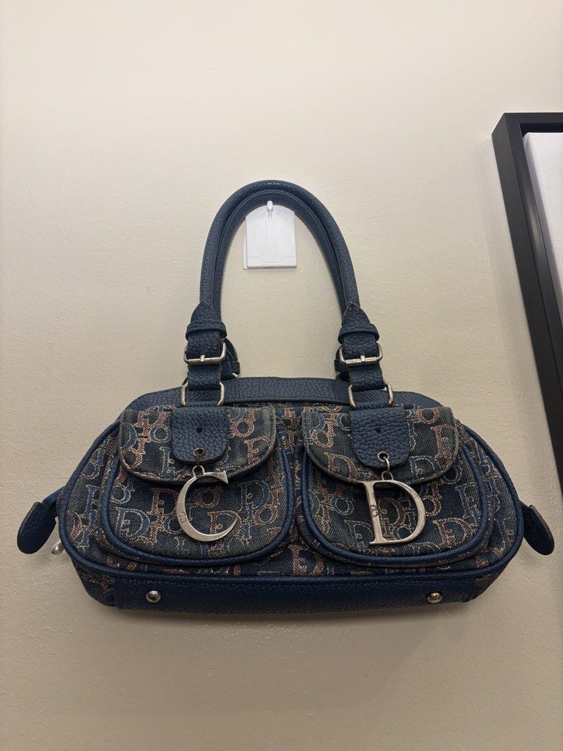 Christian Dior Monogram Denim Shoulder Canvas Bag (Category: Luxury Bags & Wallets) located in Manila. Submitted by elevist (Listing ID 1449949006, Image 2). Description: - Authentic Dior monogram denim shoulder bag - Features two front pockets with CD and D charms - Genuine leather trim and handles - Secure zipper closure - A timeless addition to your collection - Ideal for everyday wear.
