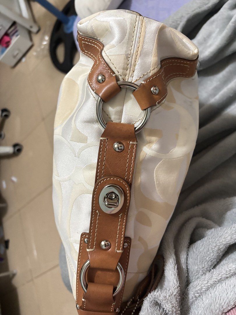 Coach Signature Monogram Shoulder Bag (Category: Luxury Bags & Wallets) located in Cavite. Submitted by kimmy.019 (Listing ID 1449805991, Image 3). Description: - Classic Coach monogram shoulder bag - Cream and tan signature pattern - Genuine leather trim and straps - Silver hardware details - Spacious interior - Ideal for everyday and office use .