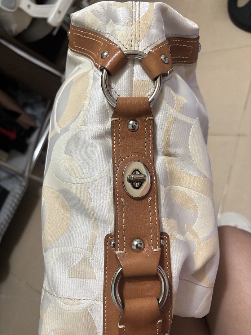 Coach Signature Monogram Shoulder Bag (Category: Luxury Bags & Wallets) located in Cavite. Submitted by kimmy.019 (Listing ID 1449805991, Image 2). Description: - Classic Coach monogram shoulder bag - Cream and tan signature pattern - Genuine leather trim and straps - Silver hardware details - Spacious interior - Ideal for everyday and office use .