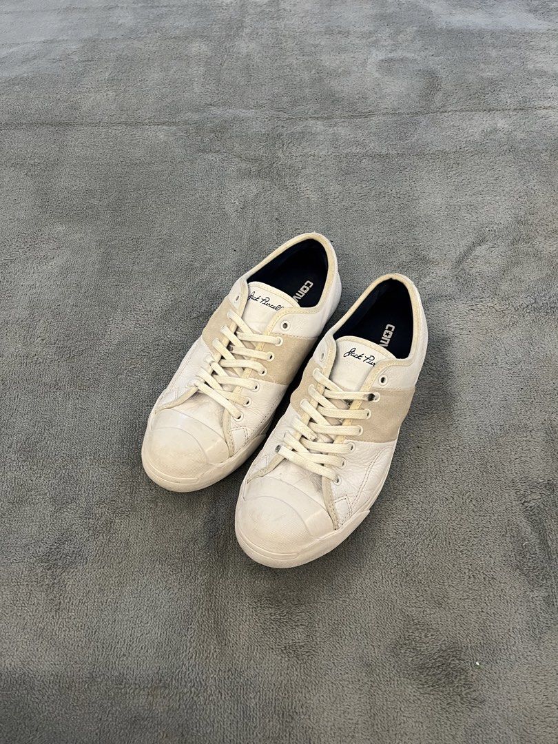 Converse Jack Purcell White Leather Low Top Sneakers (Category: Sneakers) located in Quezon City. Submitted by markieexp (Listing ID 1449886638, Image 1). Description: - Classic Converse Jack Purcell low top sneakers - White leather with signature suede stripe across the toe box - Men's Size 9 - Ideal for everyday casual wear - Shows some signs of wear on soles and uppers, adding character.