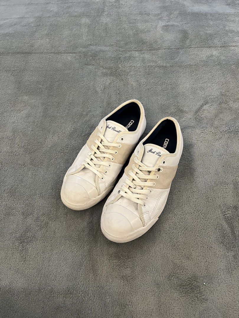 Converse Jack Purcell White Leather Low Top Sneakers (Category: Sneakers) located in Caloocan City. Submitted by maempenafi21452 (Listing ID 1449948402, Image 1). Description: - Classic Converse Jack Purcell low top sneakers - White leather with signature suede stripe across the toe box - Men's Size 9 - Ideal for everyday casual wear - Shows some signs of wear on soles and uppers, adding character.