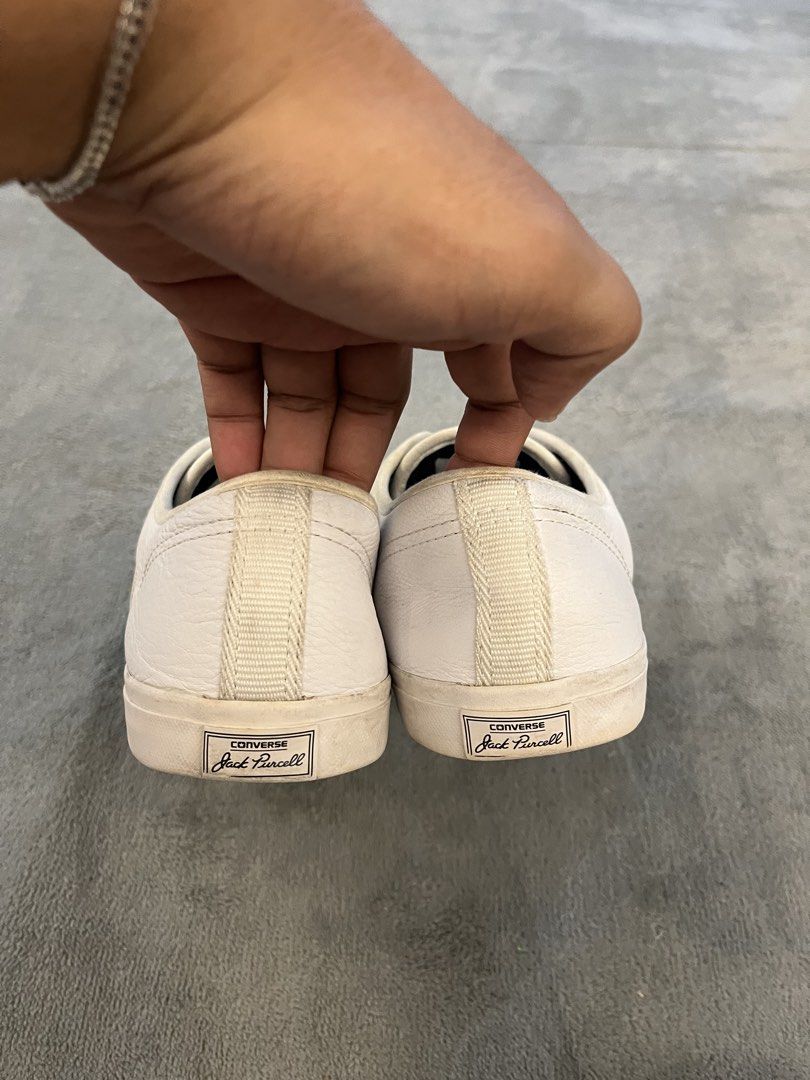 Converse Jack Purcell White Leather Low Top Sneakers (Category: Sneakers) located in Caloocan City. Submitted by maempenafi21452 (Listing ID 1449948402, Image 3). Description: - Classic Converse Jack Purcell low top sneakers - White leather with signature suede stripe across the toe box - Men's Size 9 - Ideal for everyday casual wear - Shows some signs of wear on soles and uppers, adding character.