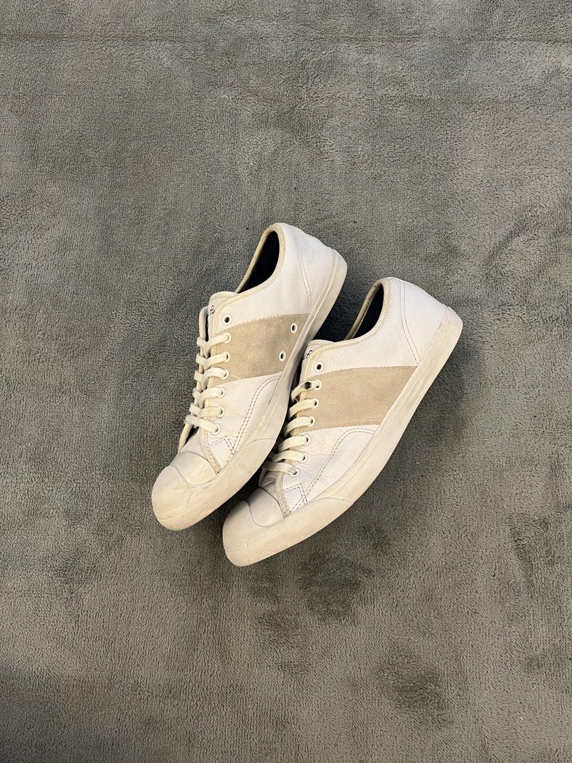 Converse Jack Purcell White Leather Low Top Sneakers (Category: Sneakers) located in Caloocan City. Submitted by maempenafi21452 (Listing ID 1449948402, Image 2). Description: - Classic Converse Jack Purcell low top sneakers - White leather with signature suede stripe across the toe box - Men's Size 9 - Ideal for everyday casual wear - Shows some signs of wear on soles and uppers, adding character.
