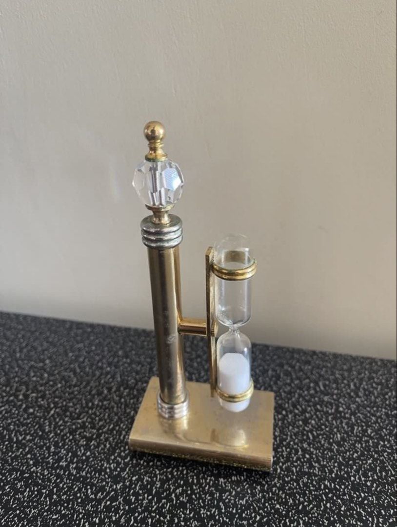 Decorative Hourglass with Crystal Accent (Category: Vintage Collectibles) located in Manila. Submitted by dstrangerthings (Listing ID 1449841081, Image 2). Description: Vintage hourglass - Gold-toned metal frame - Clear crystal top - Glass hourglass with white sand - 3minute time - Unique decorative piece -issue need to handle properly some parts can disassemble if not used properly..