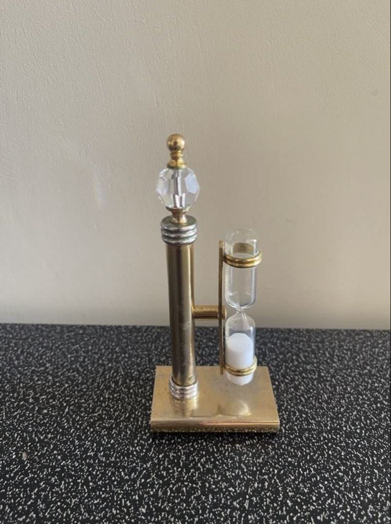 Decorative Hourglass with Crystal Accent (Category: Vintage Collectibles) located in Manila. Submitted by dstrangerthings (Listing ID 1449841081, Image 3). Description: Vintage hourglass - Gold-toned metal frame - Clear crystal top - Glass hourglass with white sand - 3minute time - Unique decorative piece -issue need to handle properly some parts can disassemble if not used properly..