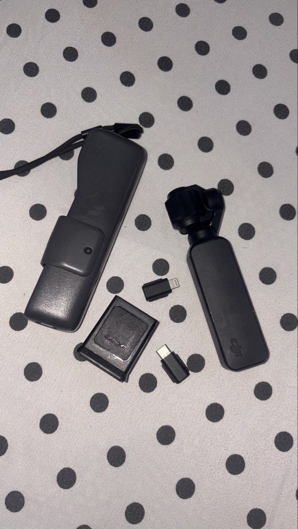 DJI Osmo Pocket 1 Gimbal Camera with Accessories (Category: Cameras) located in Bulacan. Submitted by eminemms (Listing ID 1449894685, Image 3). Description: - Capture smooth, stabilized video anywhere. - Compact and portable design. - Includes charging case for extended use. - Comes with USB-C and Lightning adapters for versatile connectivity. - Ideal for travel and everyday adventures. -Battery: 9/10 -9.5/10 Performance -RFS: Upgrade 📍Payment 