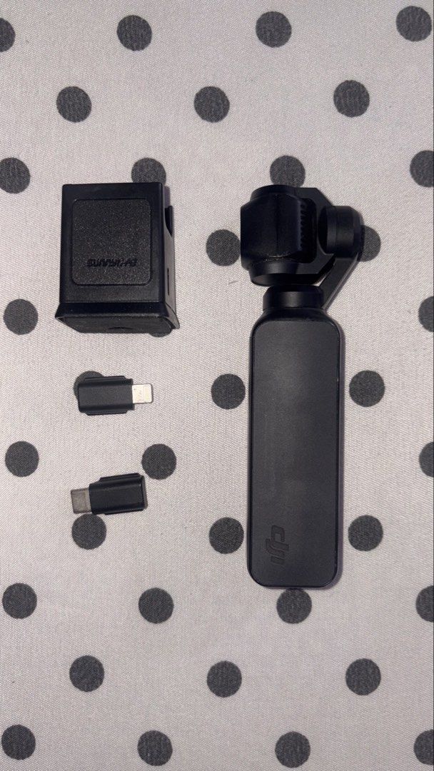 DJI Osmo Pocket 1 Gimbal Camera with Accessories (Category: Cameras) located in Bulacan. Submitted by eminemms (Listing ID 1449894685, Image 1). Description: - Capture smooth, stabilized video anywhere. - Compact and portable design. - Includes charging case for extended use. - Comes with USB-C and Lightning adapters for versatile connectivity. - Ideal for travel and everyday adventures. -Battery: 9/10 -9.5/10 Performance -RFS: Upgrade 📍Payment 