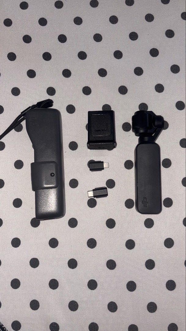 DJI Osmo Pocket 1 Gimbal Camera with Accessories (Category: Cameras) located in Bulacan. Submitted by eminemms (Listing ID 1449894685, Image 2). Description: - Capture smooth, stabilized video anywhere. - Compact and portable design. - Includes charging case for extended use. - Comes with USB-C and Lightning adapters for versatile connectivity. - Ideal for travel and everyday adventures. -Battery: 9/10 -9.5/10 Performance -RFS: Upgrade 📍Payment 