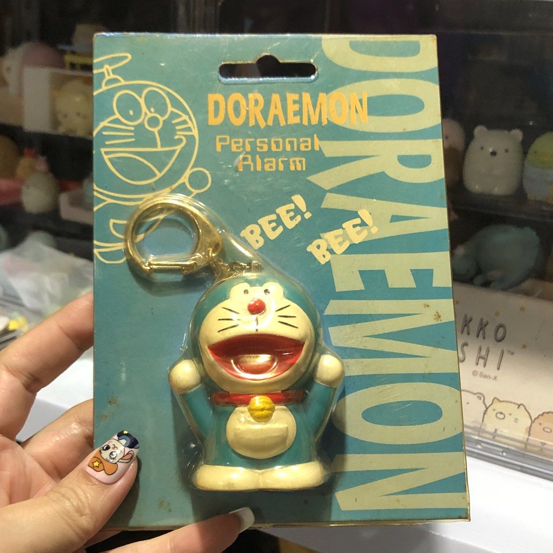DORAEMON PERSONAL ALARM KEYCHAIN - AS IS, UNTESTED! (Category: Character Goods) located in Quezon City. Submitted by kitsune.treasures (Listing ID 1449875027, Image 1). Description: *First to pay policy! *1 day reservation only. Failure to pay on time, auto cancel. 📍Quezon City * MOD: J&T | Lalamove * MOP: GCASH | BPI 📦ON HAND AND READY TO SHIP! CONDITION: WHAT YOU SEE IS WHAT YOU GET. Dimensions: Kindly check the photos for the actual measurem