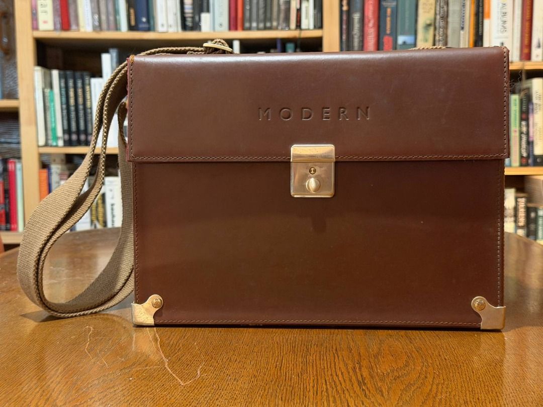 Drop It Modern Hard Case (Category: Camera Bags & Carriers) located in Pasig City. Submitted by founditatthegrove (Listing ID 1449865461, Image 1). Description: Vintage Drop It MODERN leather hard case. It has brass hardware, a canvas strap, and a padded interior with removable dividers for camera + lenses. It can fit one camera body plus two lenses, with compartments for memory cards and an iPad mini. It was only used once..