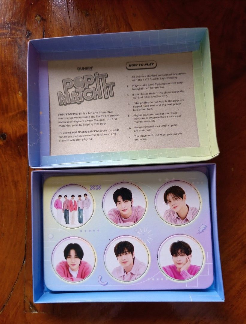 Dunkin' X TXT Pop It Match It Game (Category: Board Games & Puzzles) located in Claveria. Submitted by raiserx (Listing ID 1449819607, Image 2). Description: - Dunkin' Pop It Match It Game - Interactive memory matching game - Flip cards and find matching pairs - Collect the most pairs to win - Includes instructions - Perfect for family game nights.