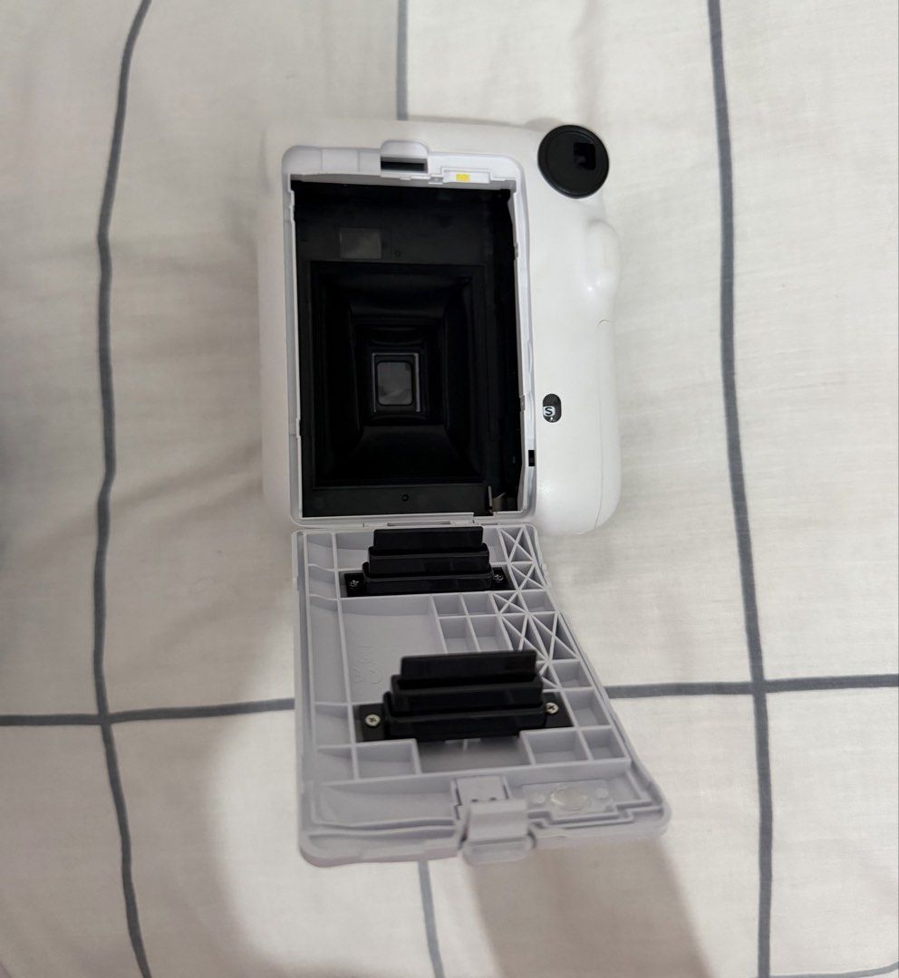 Fujifilm Instax Mini 12 Instant Camera (Category: Cameras) located in Quezon City. Submitted by torturedpoets (Listing ID 1449786416, Image 3). Description: - color: Clay White - includes original box, manual, and strap - used once - batteries not included mop: gcash/maribank buyer will shoulder sf loc: quezon city.