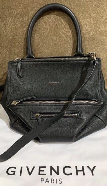 Givenchy Pandora Medium Black Leather Handbag (Category: Luxury Bags & Wallets) located in Makati City. Submitted by prebykris (Listing ID 1428031126, Image 1). Description: Guaranteed Authentic With strap, care card, and dustbag RFS: decluttering.