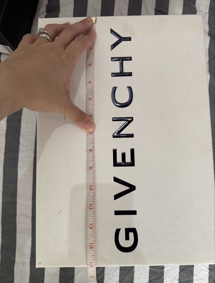 Givenchy White Shoe Box 14x10x5 (Category: Luxury Bags & Wallets) located in Pasig City. Submitted by iamloveluxe (Listing ID 1449831595, Image 2). Description: - Authentic White Givenchy box - Dimensions: Approximately 14 inches (length) x 6 inches (width) - Ideal for storage or as a stylish gift box - Features a clean and simple design.