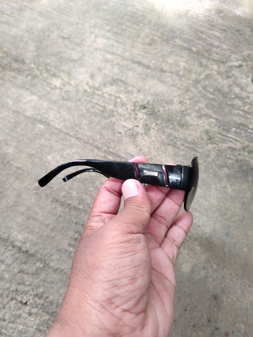 Gucci (Category: Sunglasses & Eyewear) located in Bontoc. Submitted by tedanzthrift (Listing ID 1449887718, Image 3). Description: - Gucci sunglasses - Stylish black frame with silver accents - Prominent Gucci logo on the side - Model number 6035 A2 64 14 on arm - Perfect for adding a touch of luxury to any outfit.
