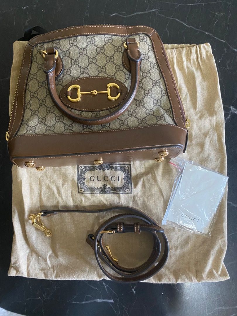 Gucci Horsebit 1955 Mini Bag (Category: Luxury Bags & Wallets) located in Manila. Submitted by haveago0dthrift (Listing ID 1449817475, Image 1). Description: - Gucci GG Supreme canvas bag - Brown leather trim - Iconic Horsebit detail - Includes dust bag and adjustable strap - Interior zip pocket - Made in Italy - Versatile for everyday or special occasions.