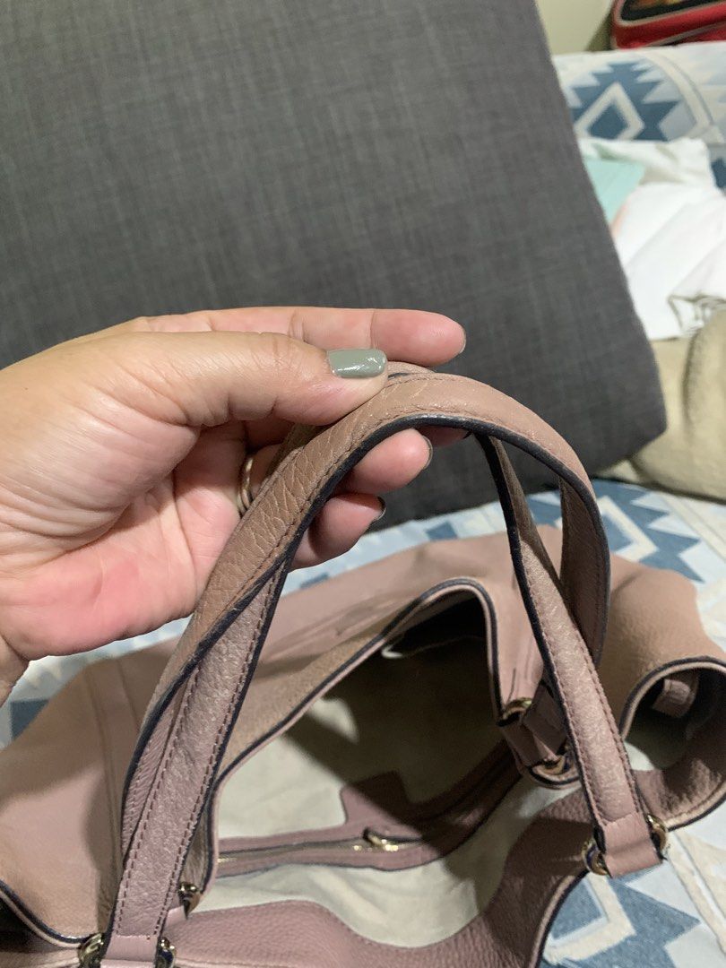 Gucci Pink Leather Monogram Tote Bag (Category: Luxury Bags & Wallets) located in Liloan. Submitted by jinalyns (Listing ID 1449900371, Image 3). Description: Gucci tote bag in a lovely pink shade. Made from textured leather. Features the iconic GG monogram embossed on the front. Spacious interior with a zippered pocket. The bottom has protective studs. Handles show some signs of wear. A classic everyday bag..