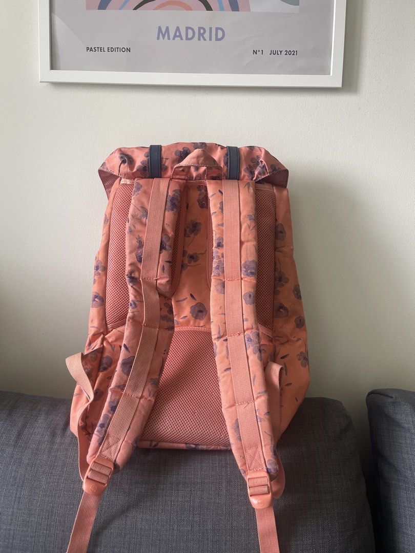 Herschel Supply Co. Backpack - Floral Pattern (Category: Backpacks) located in Manila. Submitted by declutterwnikki (Listing ID 1449781037, Image 2). Description: - Pretty Herschel backpack with a vibrant floral print - Base color: Orange-pink with purple flowers - Straps and buckle closures: Dark blue - Features padded shoulder straps for maximum comfort - Ideal for school, work, or everyday adventures - Offers ample storage space for your essen
