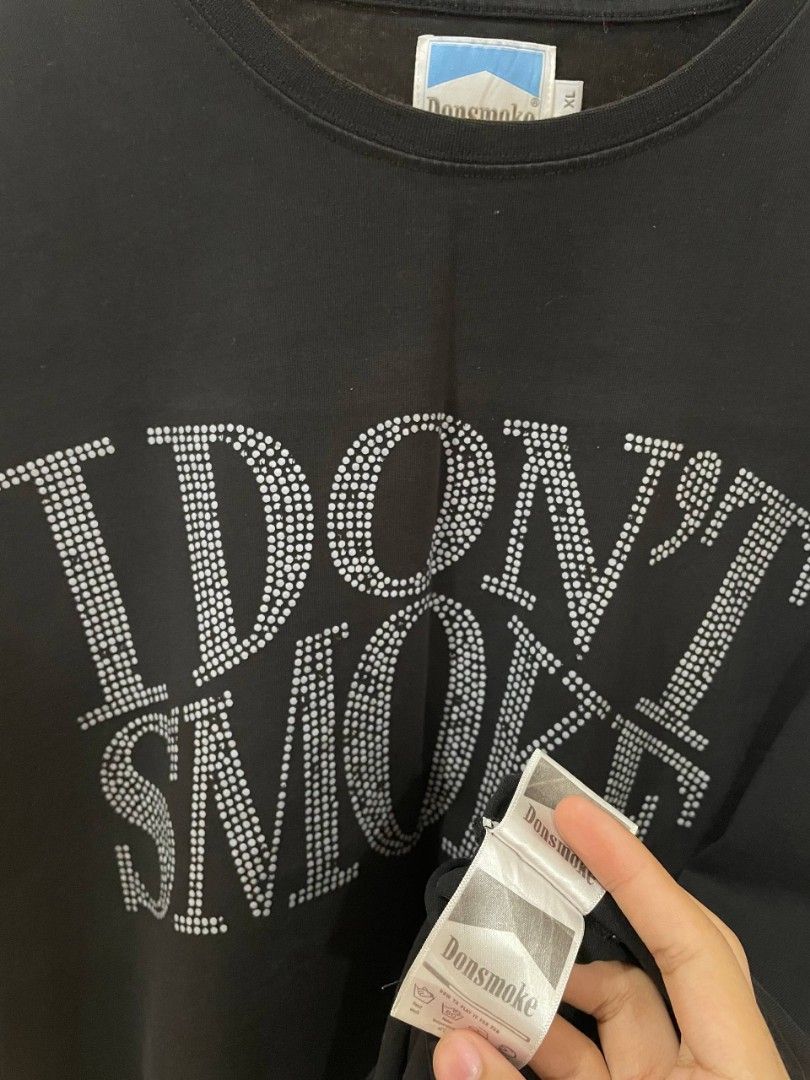 I don't smoke (Category: Tshirts & Polo Shirts ) located in Marikina City. Submitted by andreioruga (Listing ID 1449806697, Image 2). Description: size: XL width - 24 length - 29 color rate: 10/10 issue: slightly bacon neck line and front hit design condition: great dm 📩.