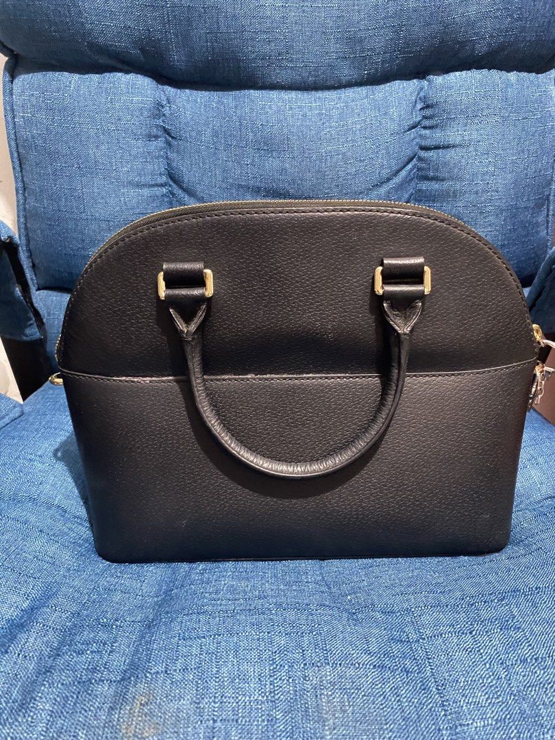 Authentic Kate Spade Black Leather Dome Satchel Bag (Category: Luxury Bags & Wallets) located in Cavite. Submitted by JandyLou (Listing ID 1449814173, Image 3). Description: - Brand: Kate Spade New York - Style: Dome Satchel - Material: Black Pebbled Leather - Features: Top handles, detachable crossbody strap - Hardware: Gold-tone - Closure: Zipper - Interior: Spacious for essentials - Condition: Like New (Color may vary due to lighting) - Price: