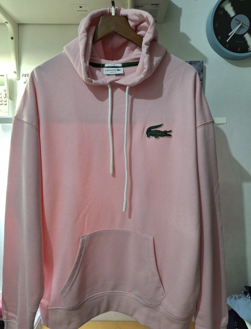 Lacoste unisex hoodie (Category: Coats, Jackets and Outerwear) located in Muntinlupa City. Submitted by kstefanomela14 (Listing ID 1449855042, Image 1). Description: Lacoste hoodie pullover light pink Loosefit small - 21x26 Medium- 22x27 Large - 23x28 Cod cop lalamove j&t.